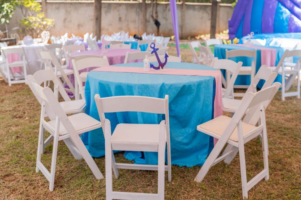 Adults white foldable seats and Round tables